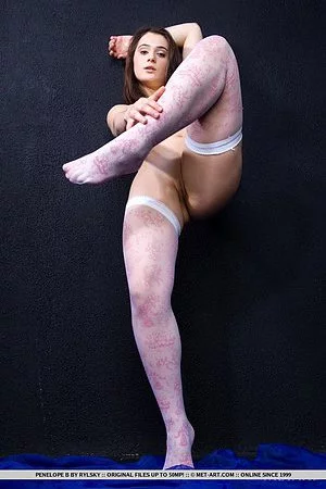 The lewd teen Penelope B is playing legs in stockings and flashing the nude cunt