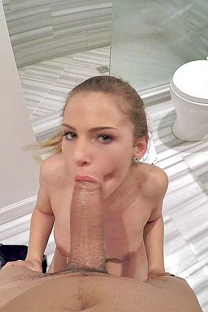 Man is holding Sydney Coleâ€™s hips when heavily penetrating her nub from behind