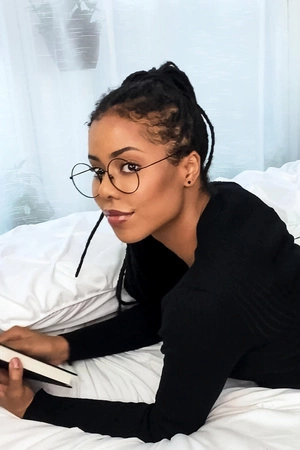 Kira Noir plays with her favorite sex toys in bed