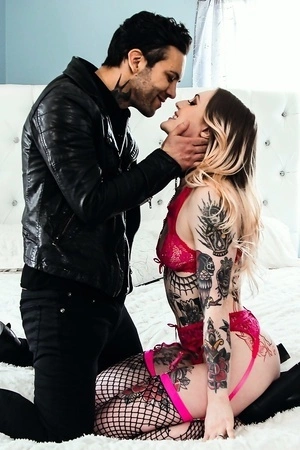 Inked slut in fishnet stockings gets fucked hard in bed