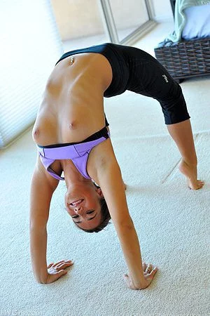 Big titted girl Eva Lovia is doing gymnastics and stripping to fill butt hole with the fingers