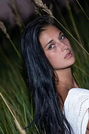 Beautiful brunette teen Katya AC allows the warm sun pet her nice naked body