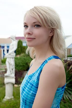 Hot blonde babe Feeona A cools off her fine body in the ocean and teases us