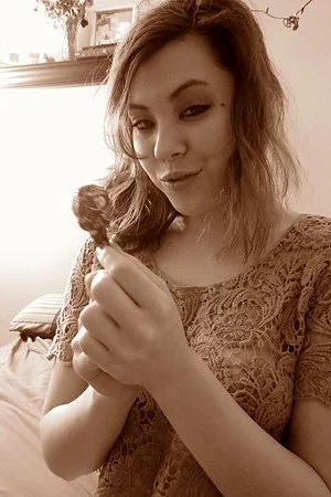 Sexy Asian chick Sydney Mai is licking the lollipop and playing it over pussy