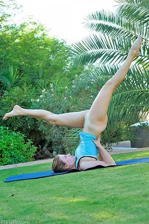 Shaved pussy girl Emilie FTV does stretching exercises outdoors with no panties