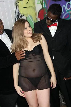 Several black pistons are filling the mouth of hungry Kinzy Jo with semen