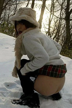 A common Asian chick Hitomi Hayasaka was caught with the nude ass pissing outdoor