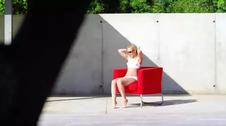 The blonde babe Sylvie Sinner looks erotic under the hot sun voyeured on cam outdoor