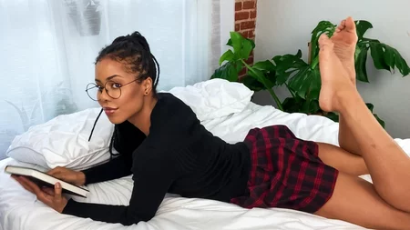 Black college girl Kira Noir plays with her favorite sex toys in bed